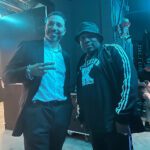 A Man And A Woman Standing Next To Each Other.